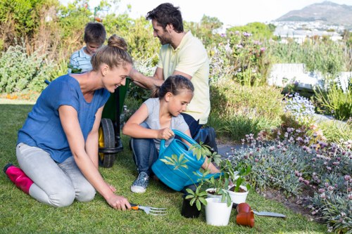 Professional gardener in Acton working on a vibrant garden